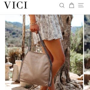 NEW with tags VICI bag in nude.